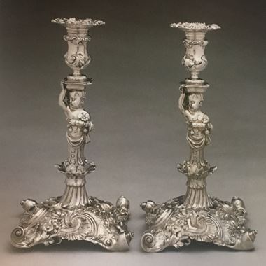 A Highly Important Pair of Figural Candlesticks