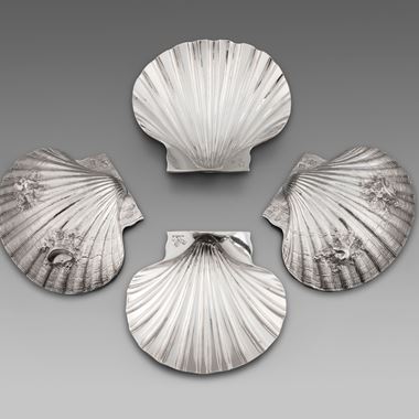 A Set of Four Paul de Lamerie Butter Shells 