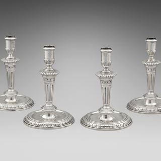 An Elegant Set of Four Round Base Candlesticks