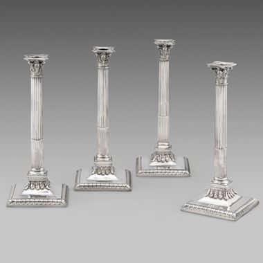 A Splendid Set of Four Corinthian Column Candlesticks
