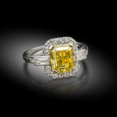 A yellow diamond and diamond ring, circa 1930