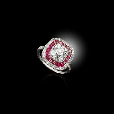 A rare art deco Diamond ring, surrounded by rubies and diamonds