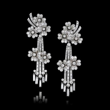 An opulent pair of mid-century diamond pendent ear clips, 1950s