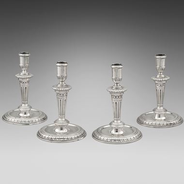 A Set of Four Queen Anne Candlesticks