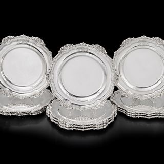A Set of Twelve Regency Silver Dinner Plates