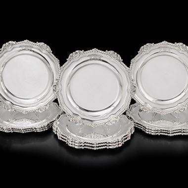 A Set of Twelve Regency Silver Dinner Plates