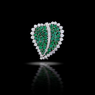An emerald and diamond leaf brooch