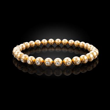 A mid-20th century gold ball and diamond necklace/bracelets