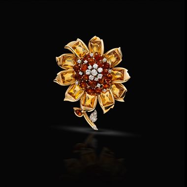 A gold, diamond and citrine flower brooch 