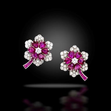 A pair of ruby and diamond flowerhead cluster earrings, circa 1930