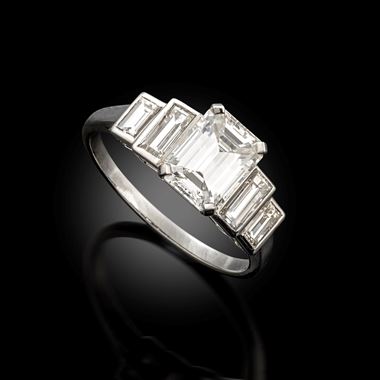 An emerald cut diamond ring