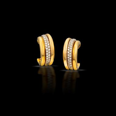 A pair of gold and diamond hoop earrings