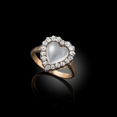 An early 20th century moonstone and old cut diamond heart shaped ring