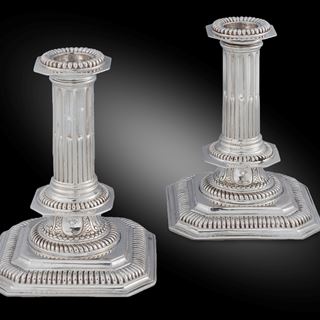 A Pair of Square Base Column Candlesticks 