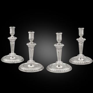 An Elegant Set of Four Round Base Candlesticks