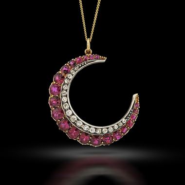 A late 19th century ruby and diamond crescent pendant