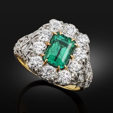 Early 20th century emerald and diamond cluster ring