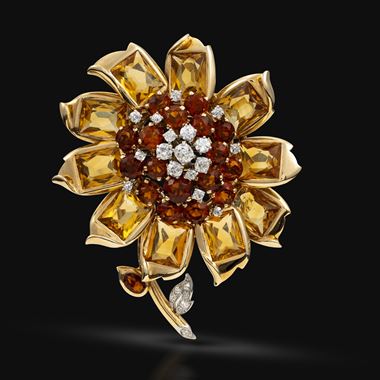 A gold, diamond and citrine flower brooch 
