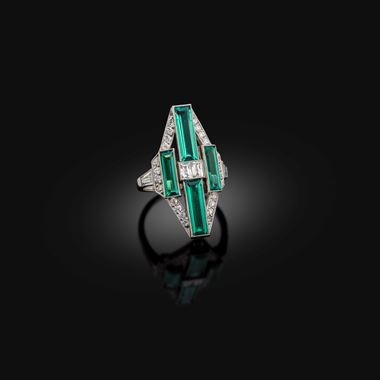 An art deco emerald and diamond cocktail ring