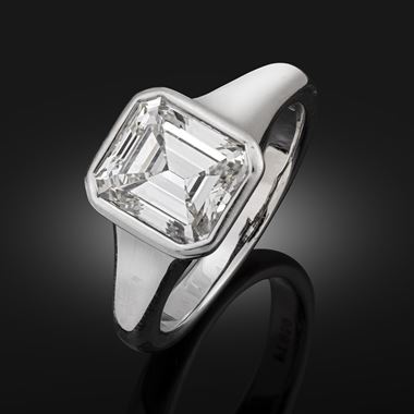 An emerald cut diamond ring