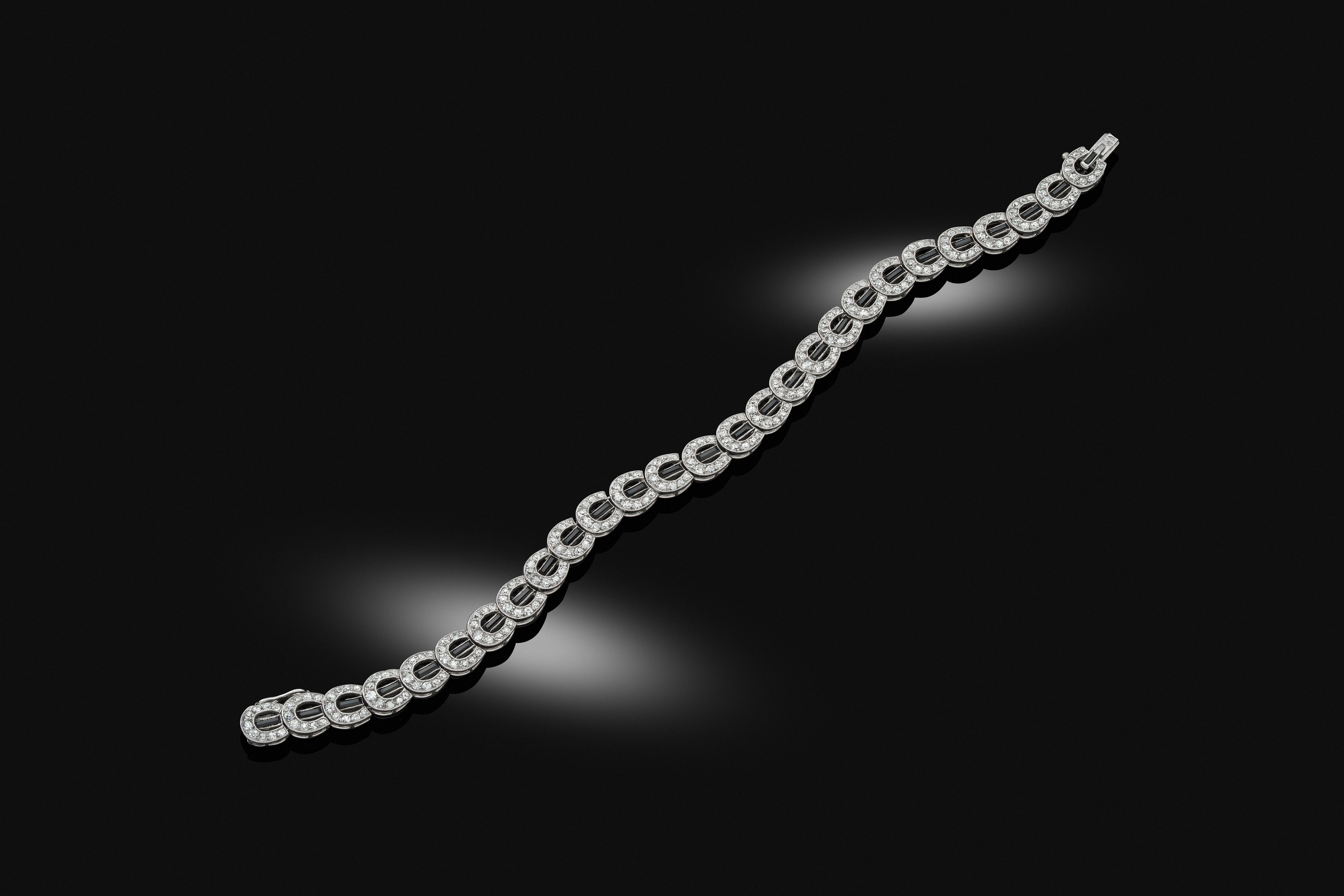 An early 20th century onyx and diamond bracelet, circa 1918