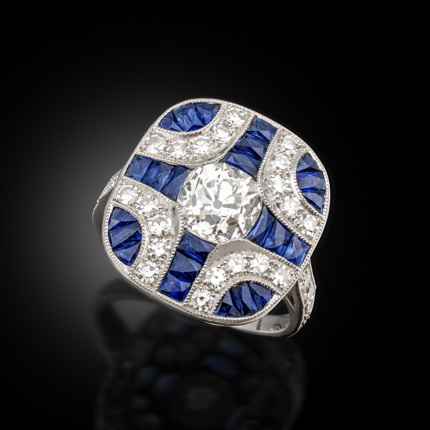 A sapphire and diamond panel ring, circa 1910