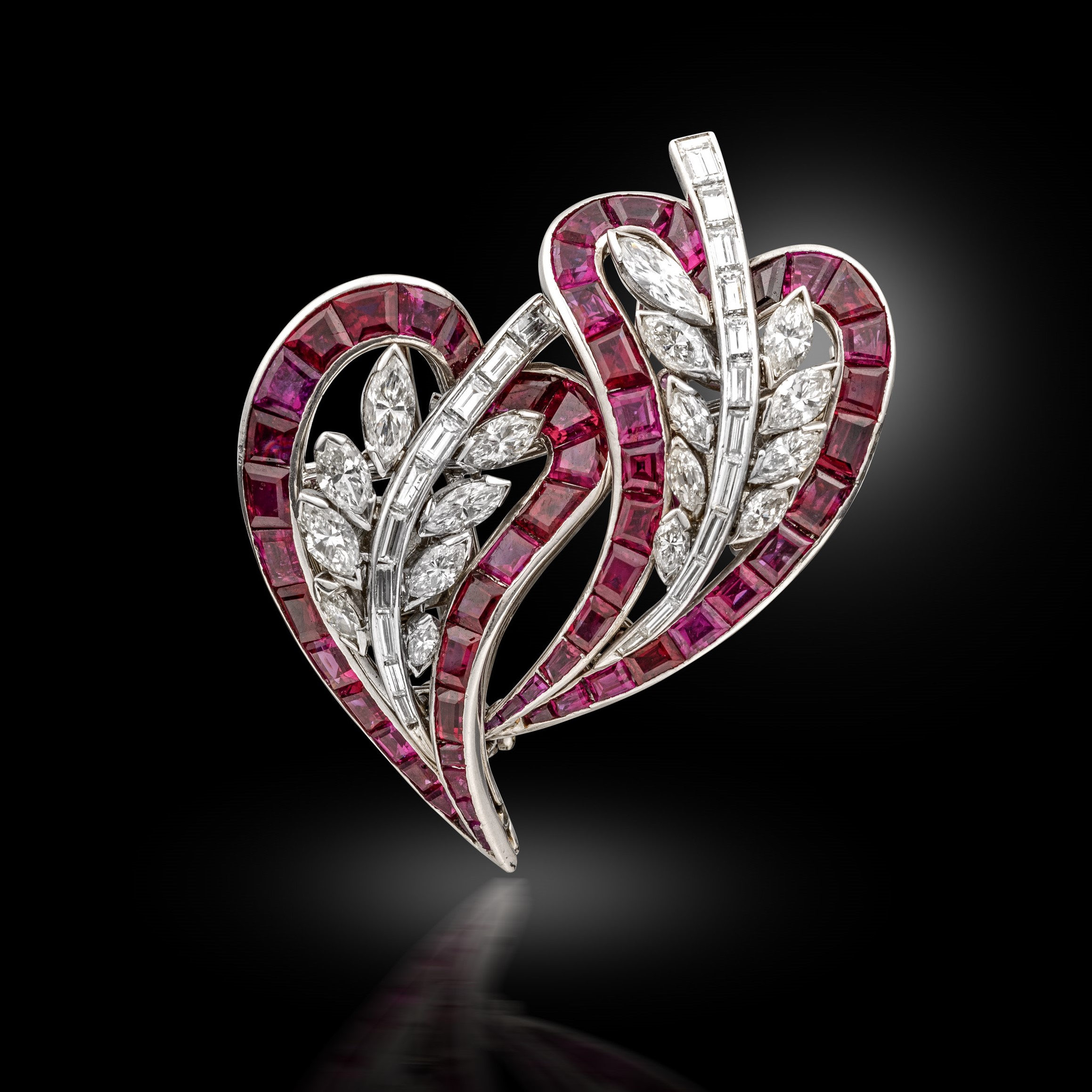 A ruby and diamond double clip brooch, circa 1945
