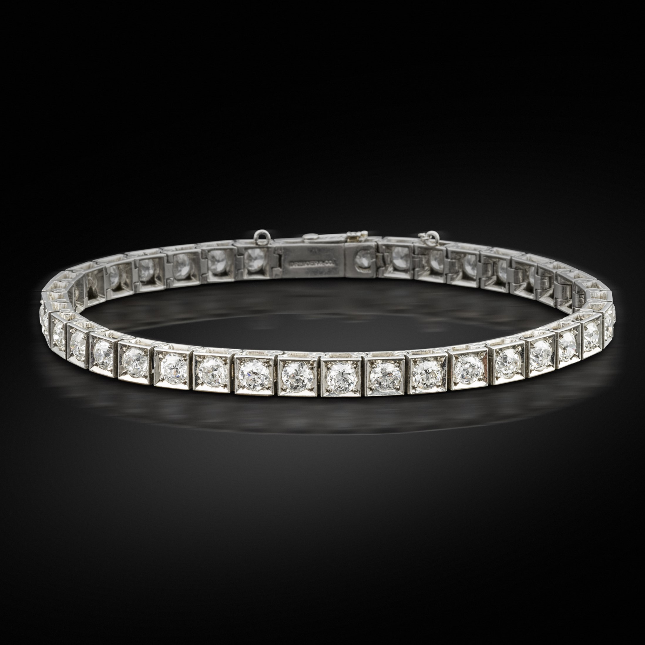 An Art Deco diamond line bracelet by Dreicer & Co
