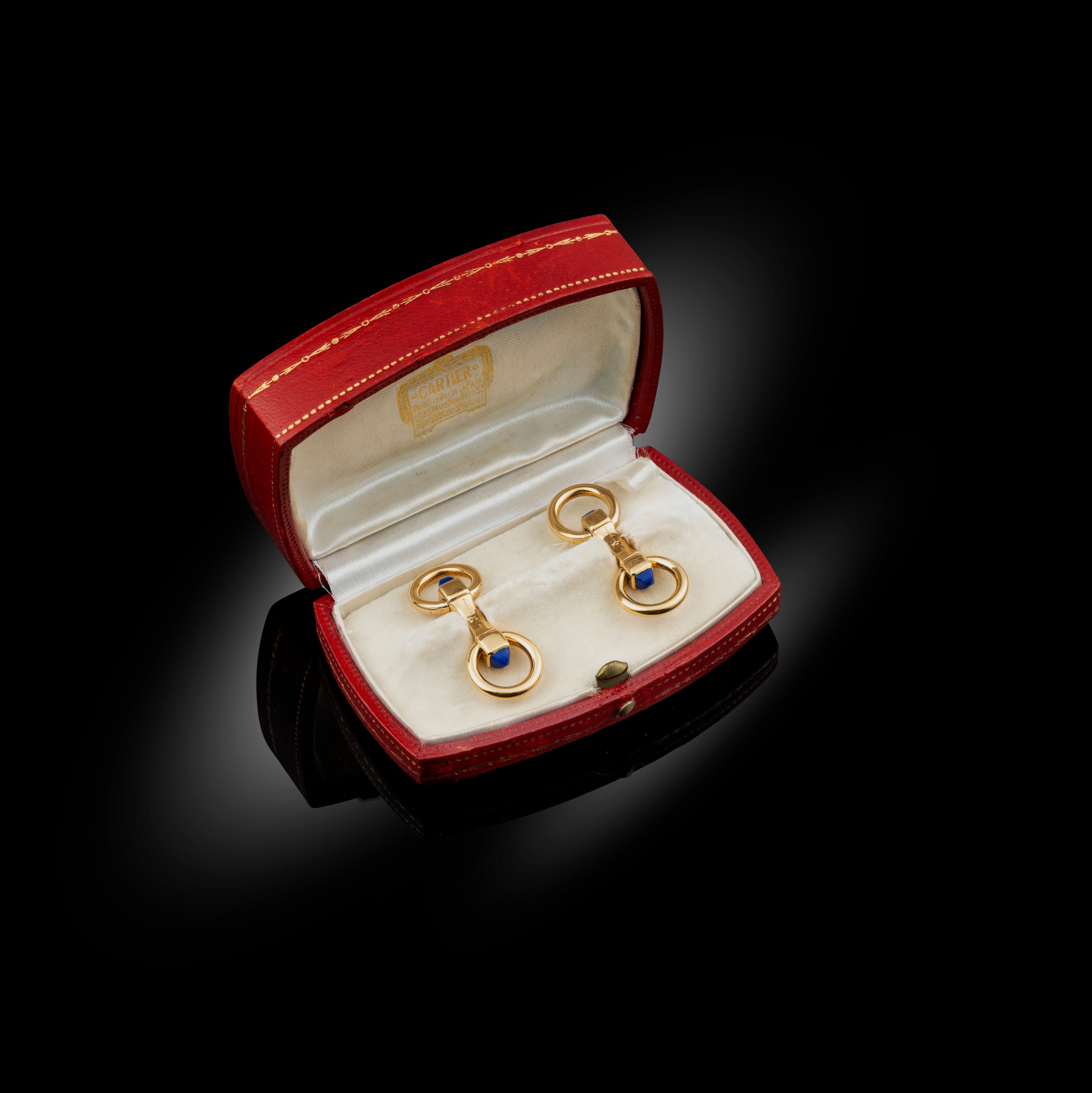 A pair of gold and lapis lazuli rounded ring cufflinks, circa 1930-31