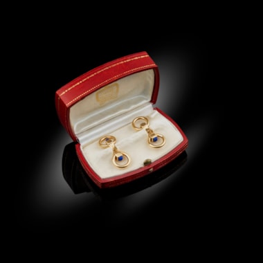 A pair of gold and lapis lazuli rounded ring cufflinks, circa 1930-31