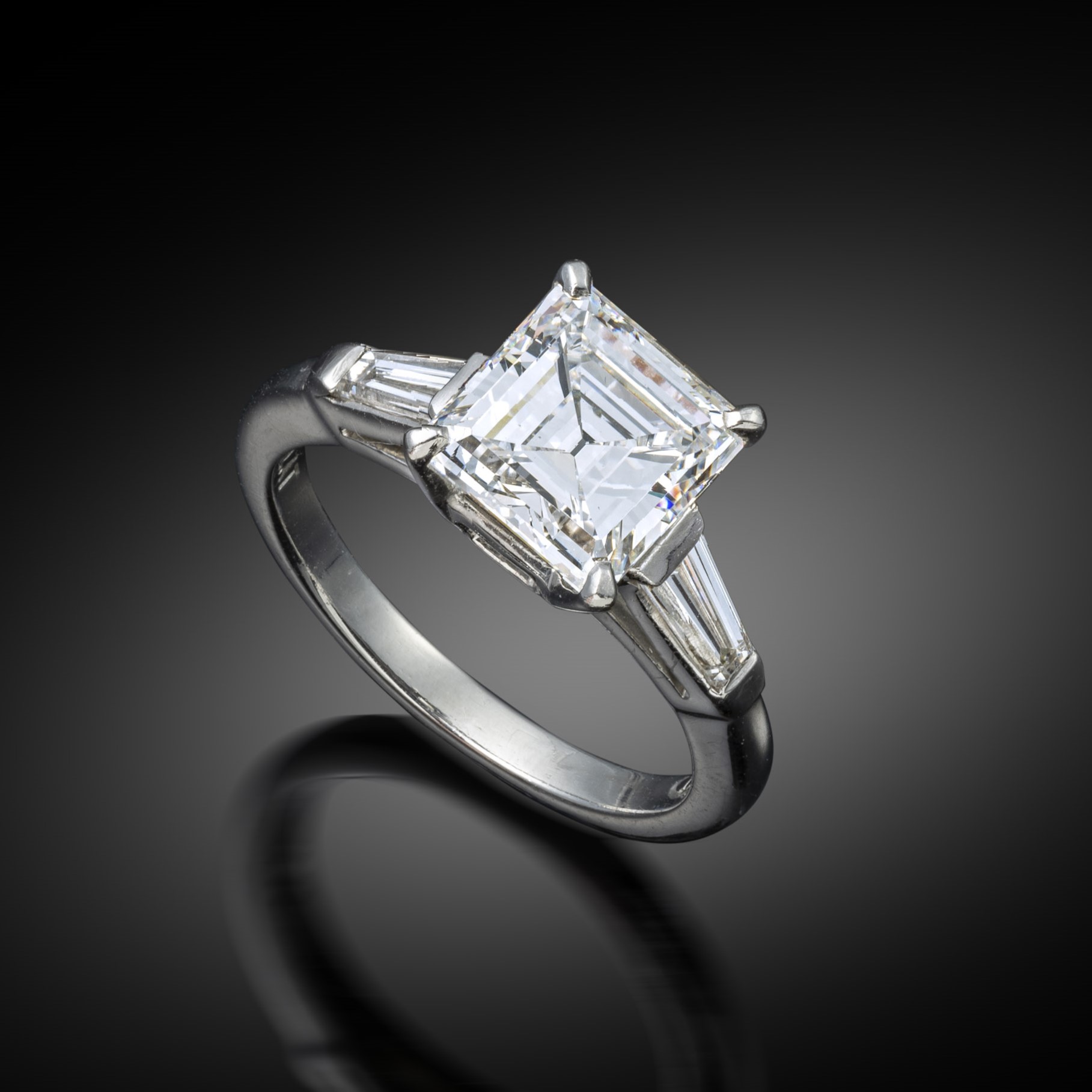 A square emerald cut diamond ring