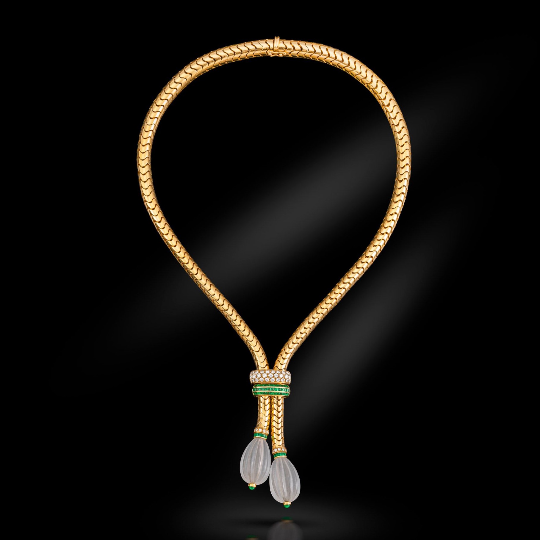 An 18k Gold, Diamond, Emerald and Rock Crystal Lariat Necklace