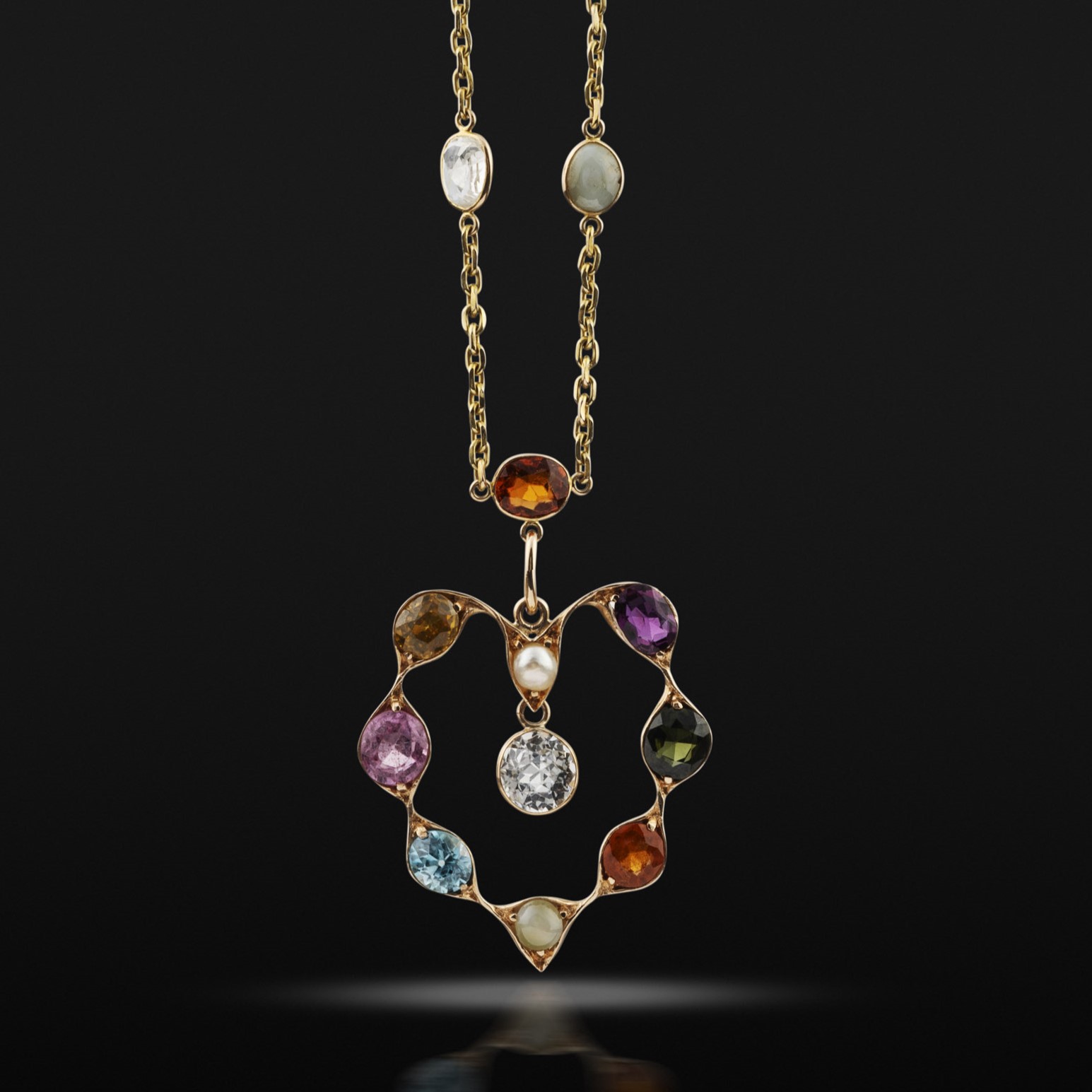 An early 20th century gold and gem set necklace, circa 1900