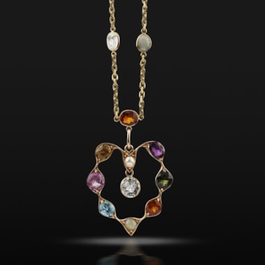 An early 20th century gold and gem set necklace, circa 1900