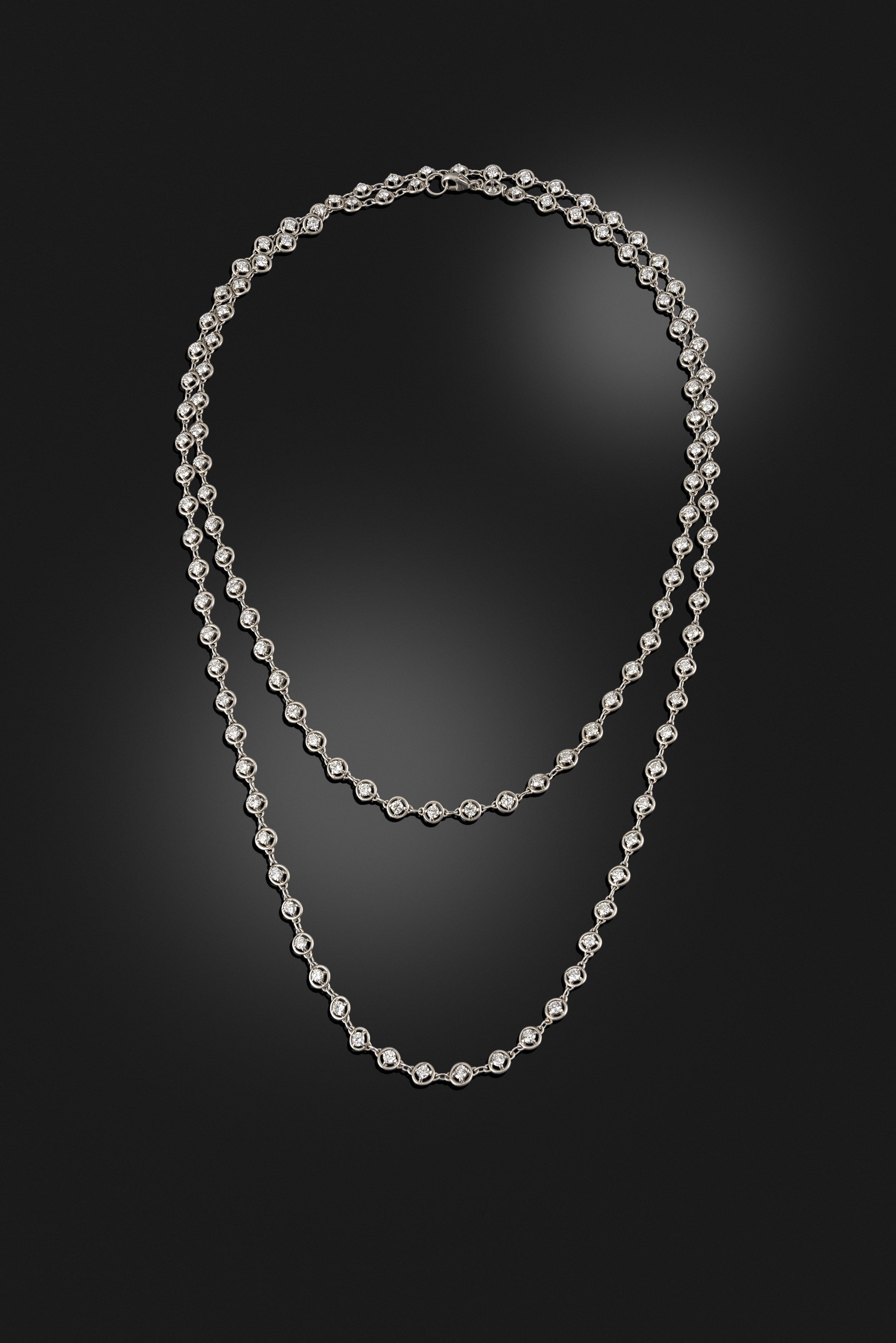 Art Deco platinum and diamond long chain, circa 1920
