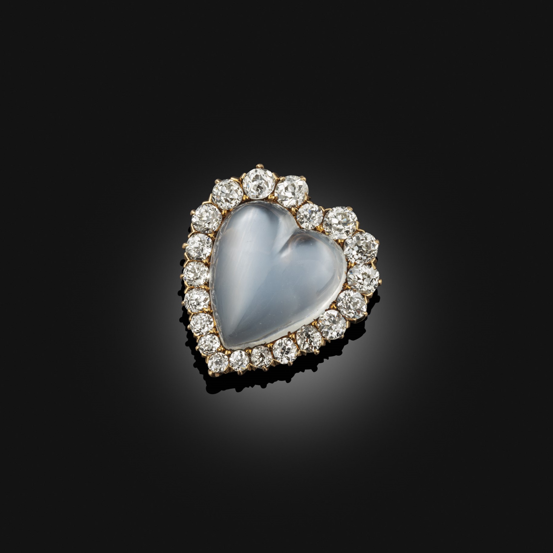 A moonstone and diamond heart shaped brooch/pendant