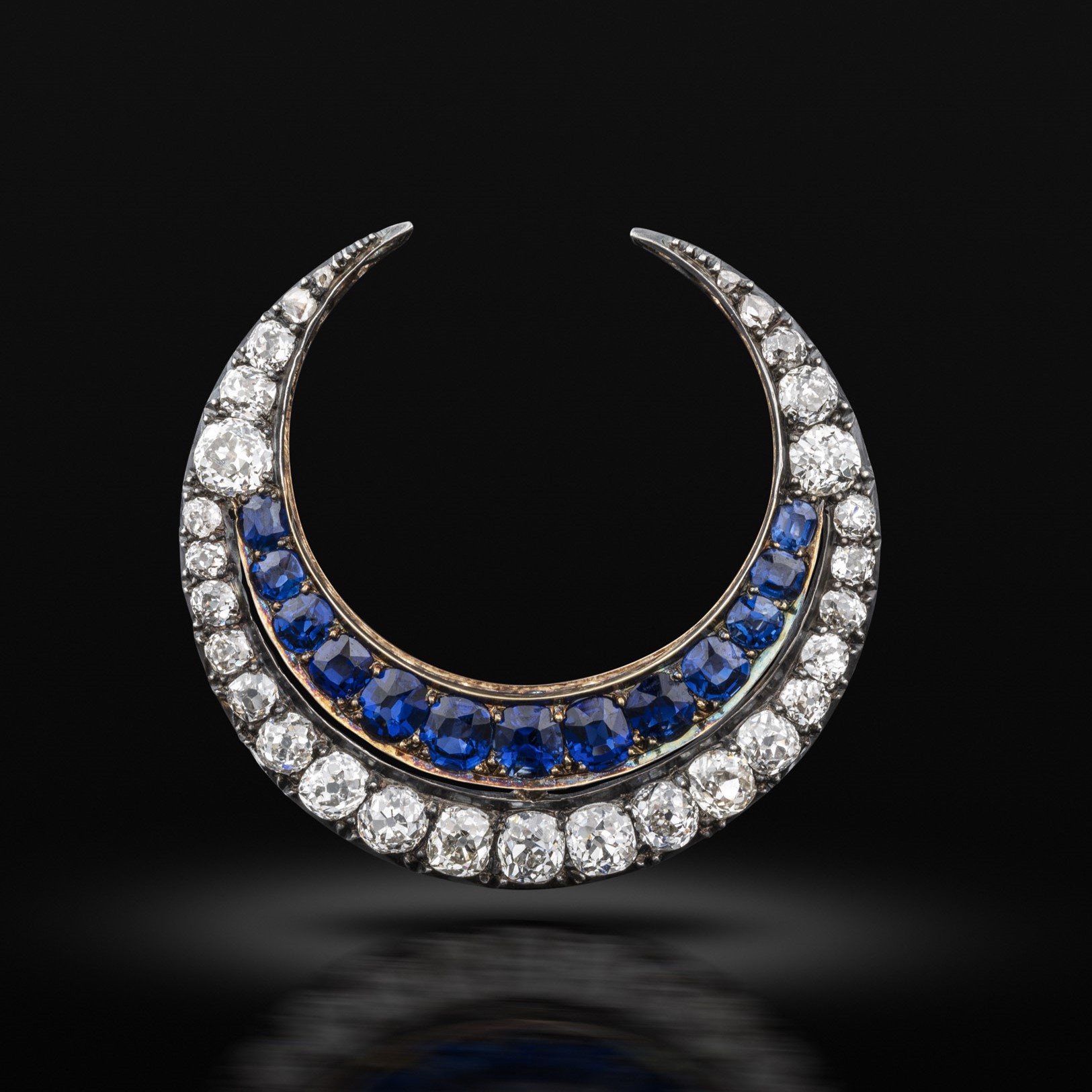 A late 19th century sapphire and diamond crescent brooch