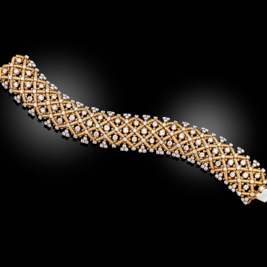 A 1940s gold and diamond strap bracelet