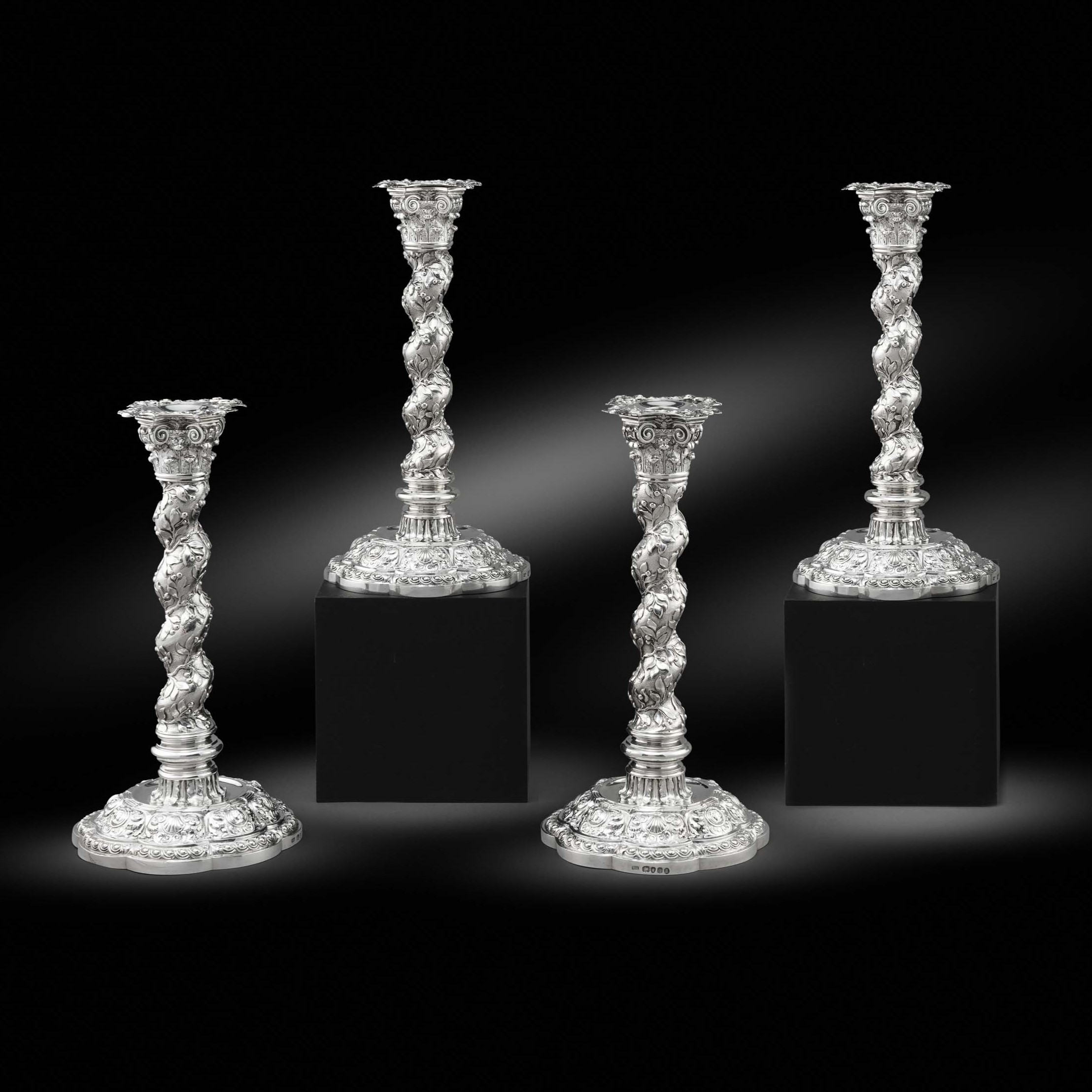 A Magnificent Set of Four George III Candlesticks