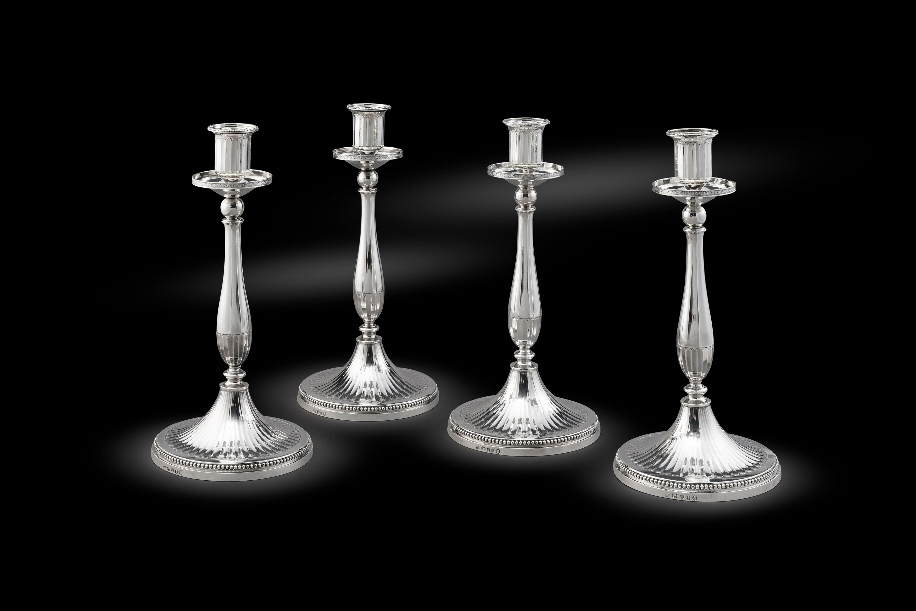 A Set of Four Neoclassical Late 18th Century Candlesticks