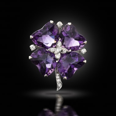 A mid-century amethyst and diamond brooch