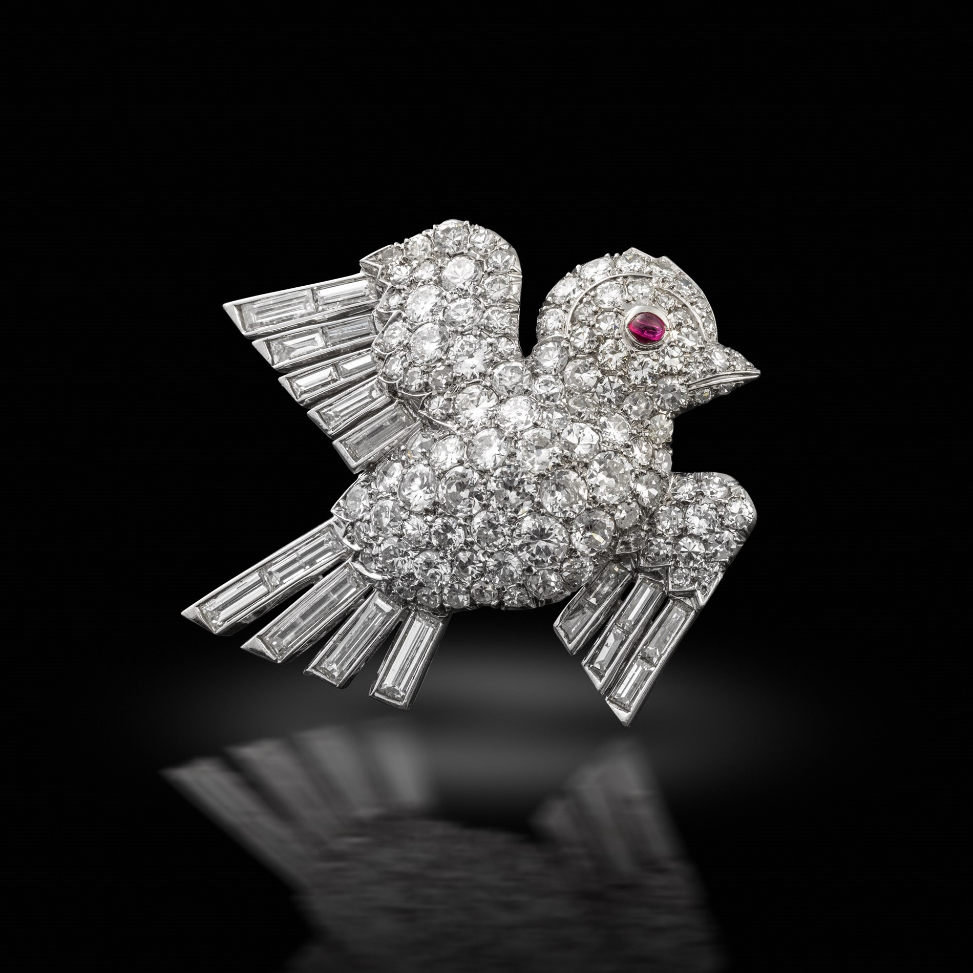 A 1930s diamond bird brooch