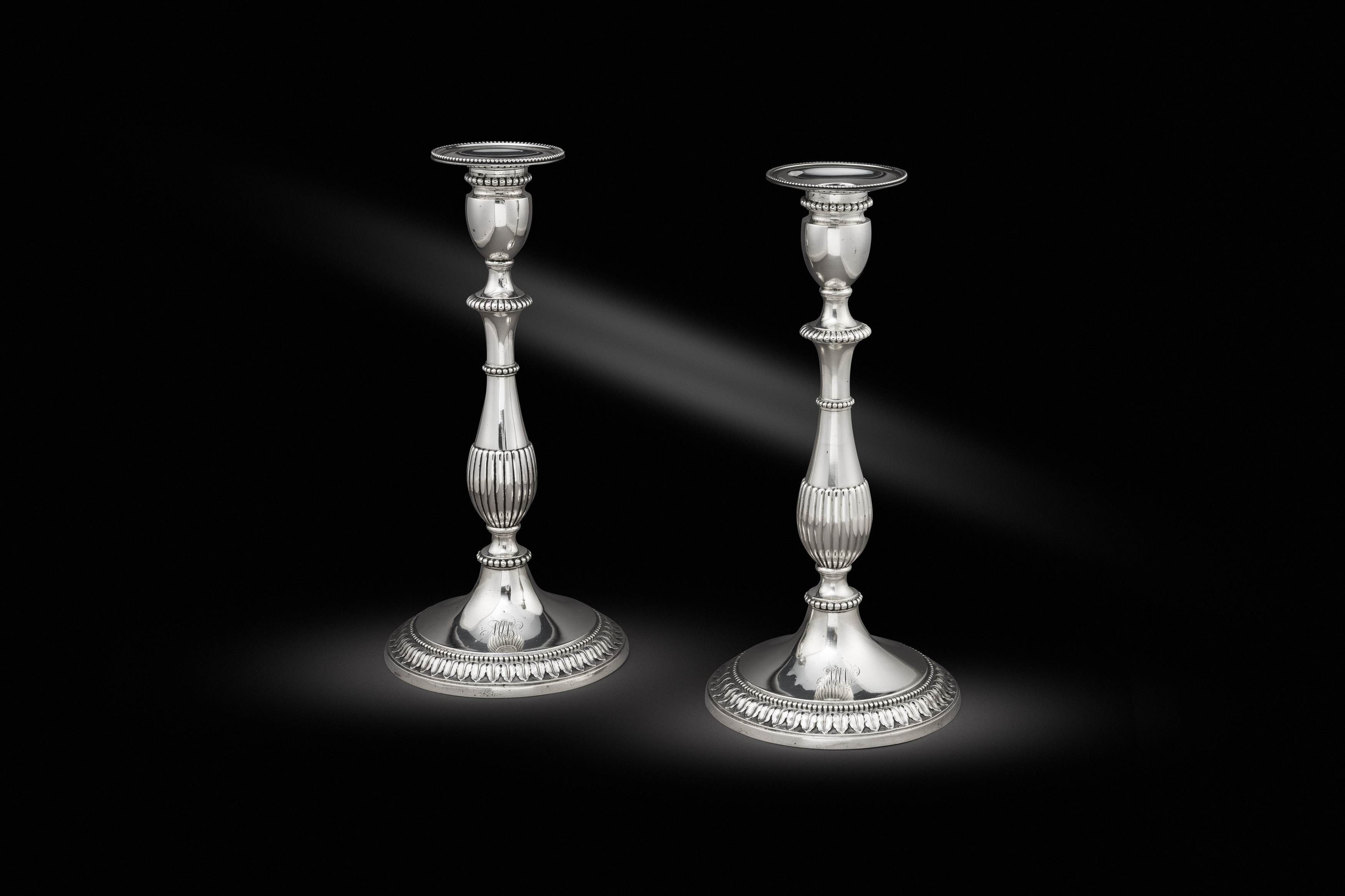  A Pair of Late 18th Century Neo-Classical Candlesticks