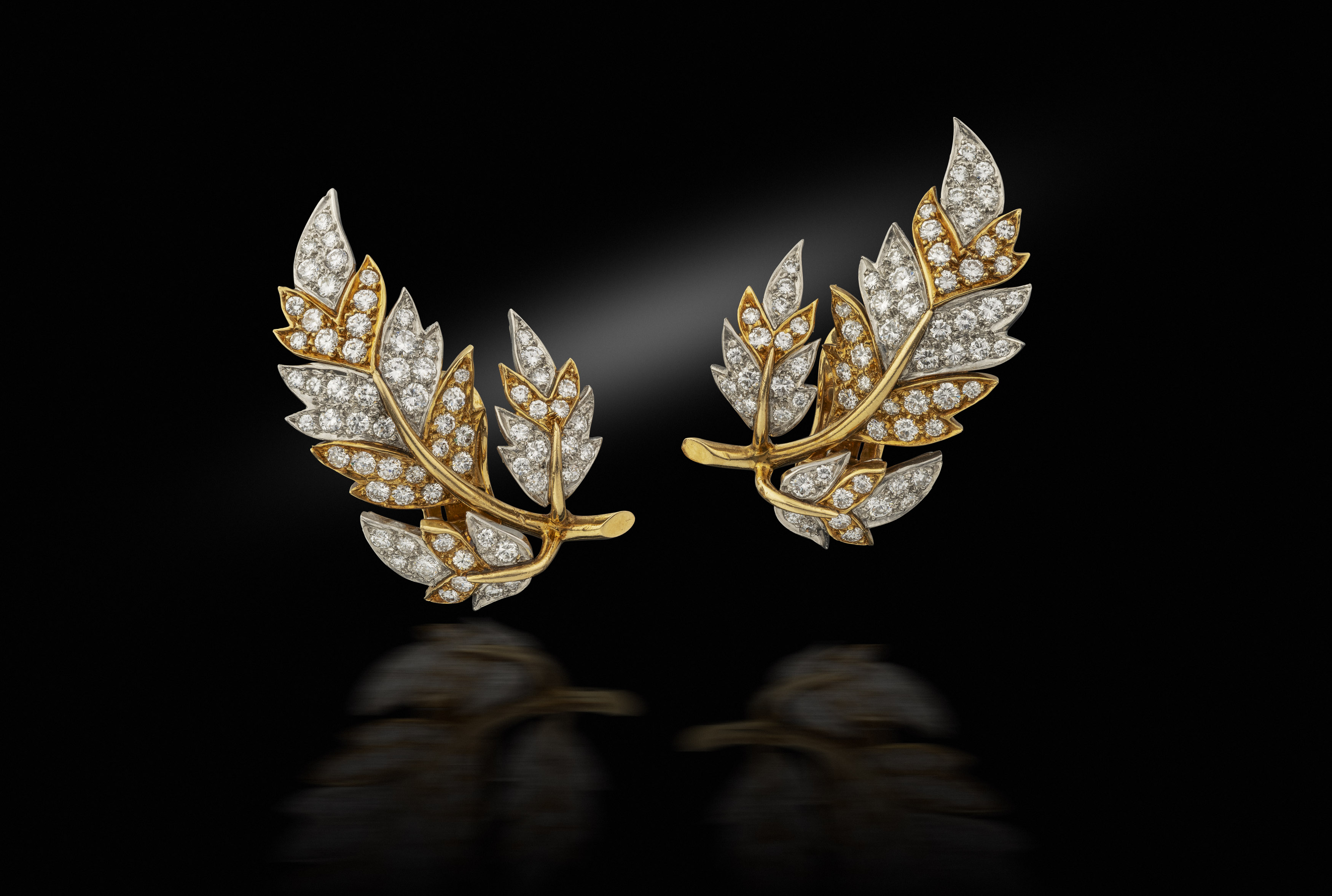A pair of 1970s French gold and diamond leaf ear clips
