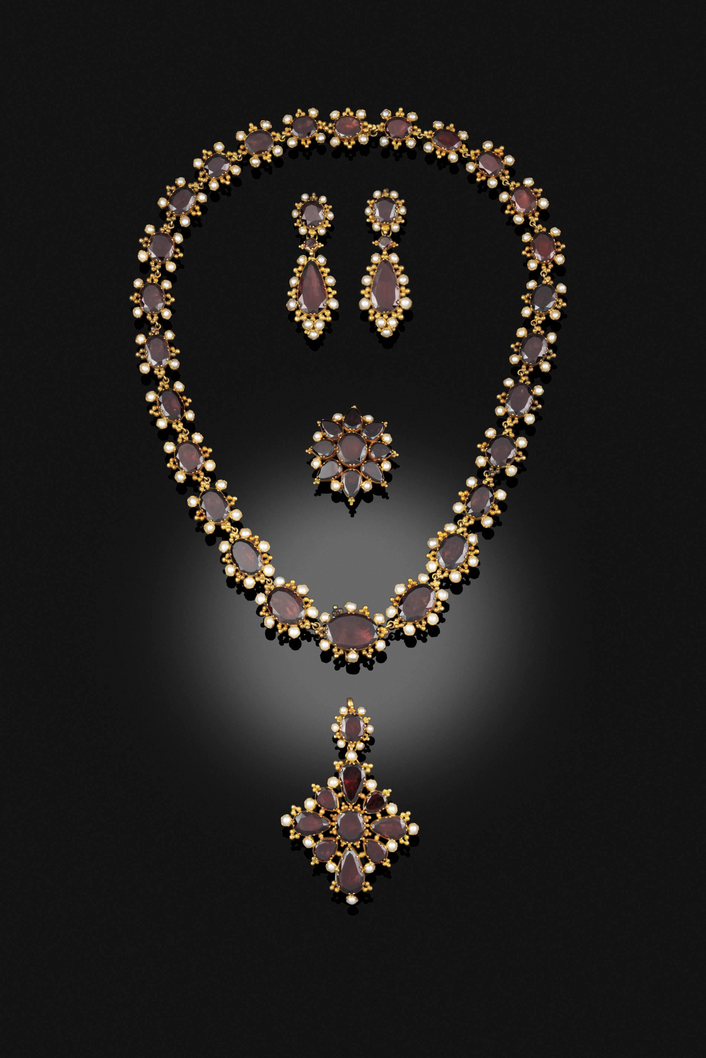 A Georgian garnet suite, circa 1820