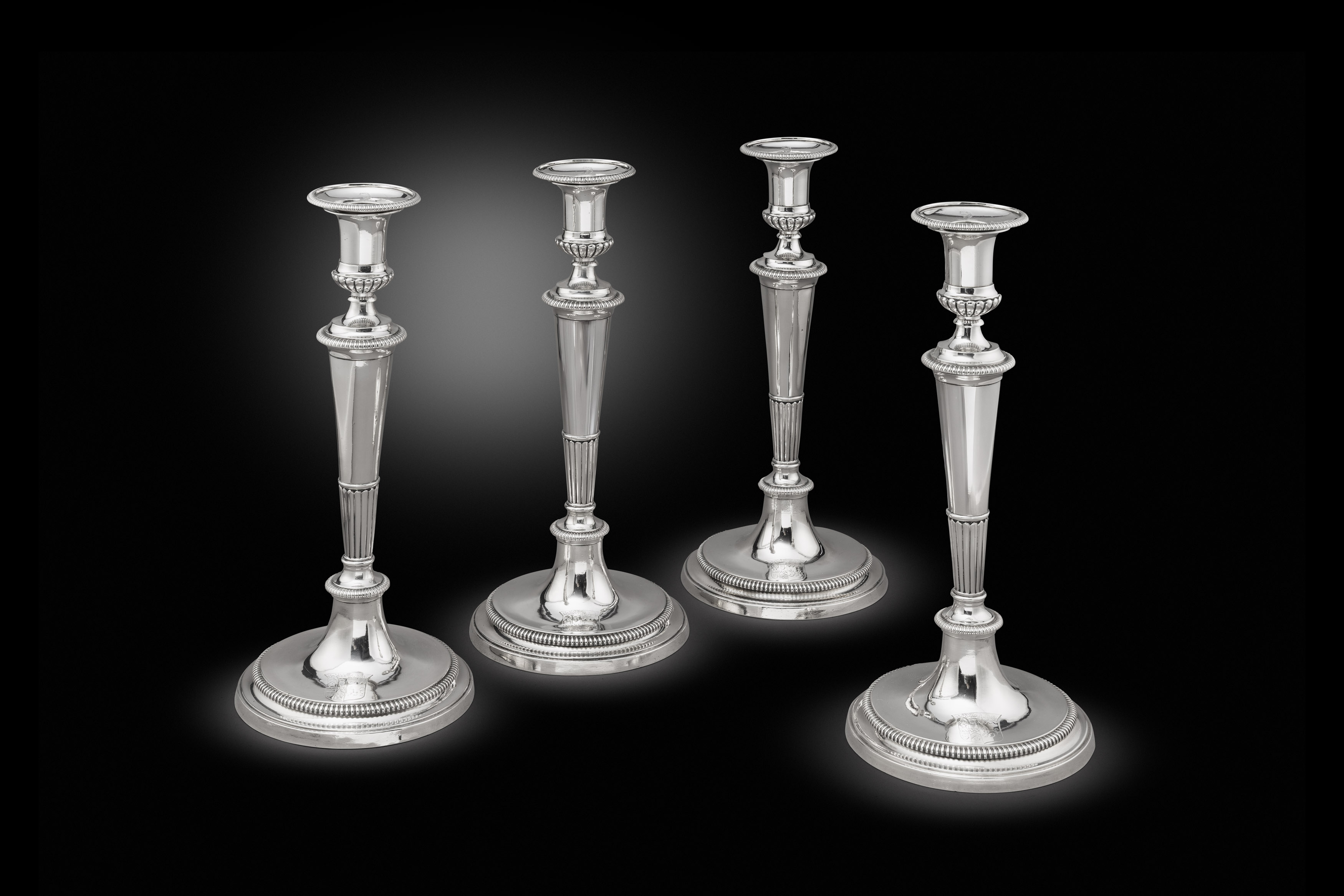 A set of four George III silver candlesticks
