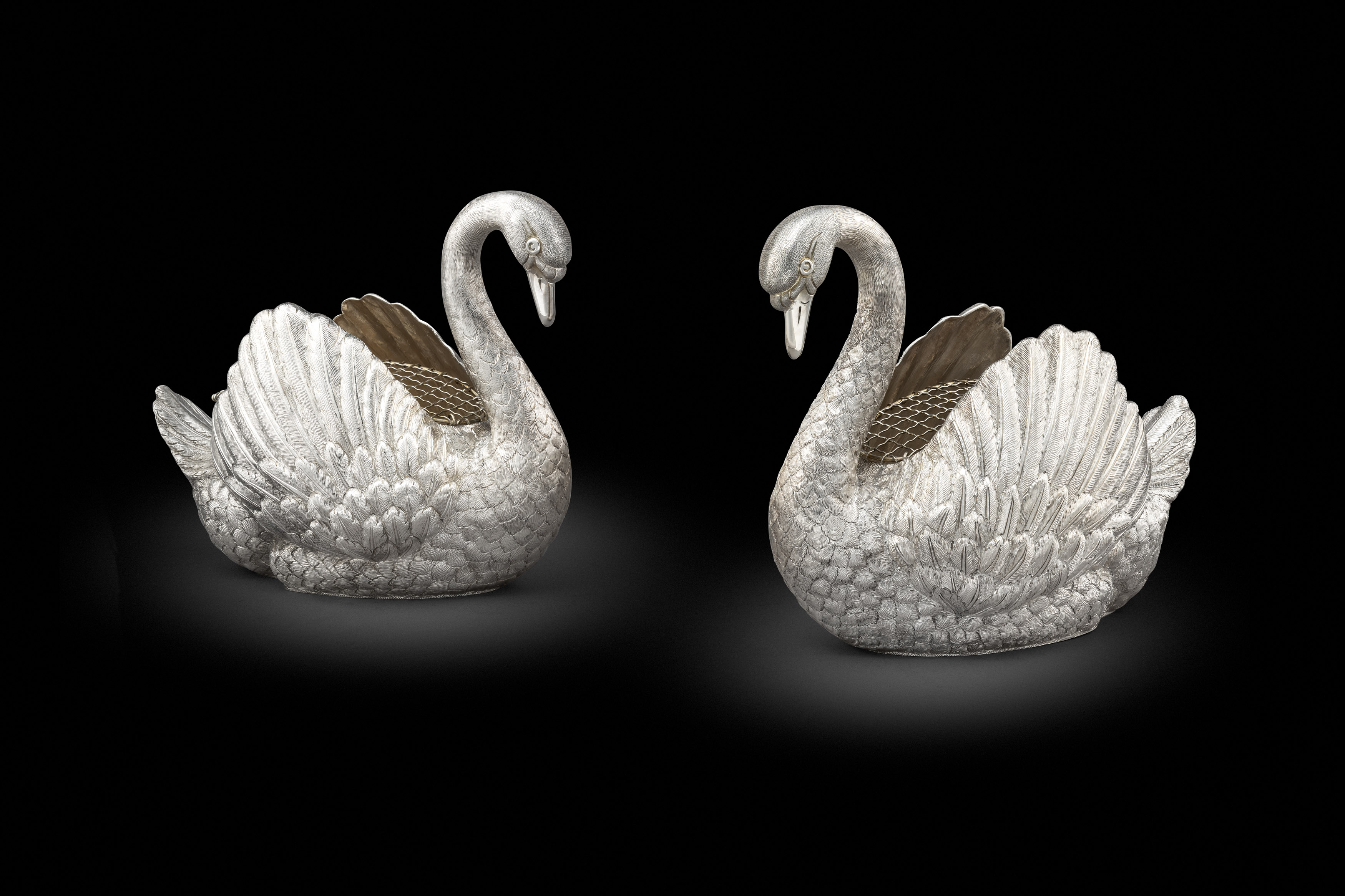 A pair of silver swan centrepieces