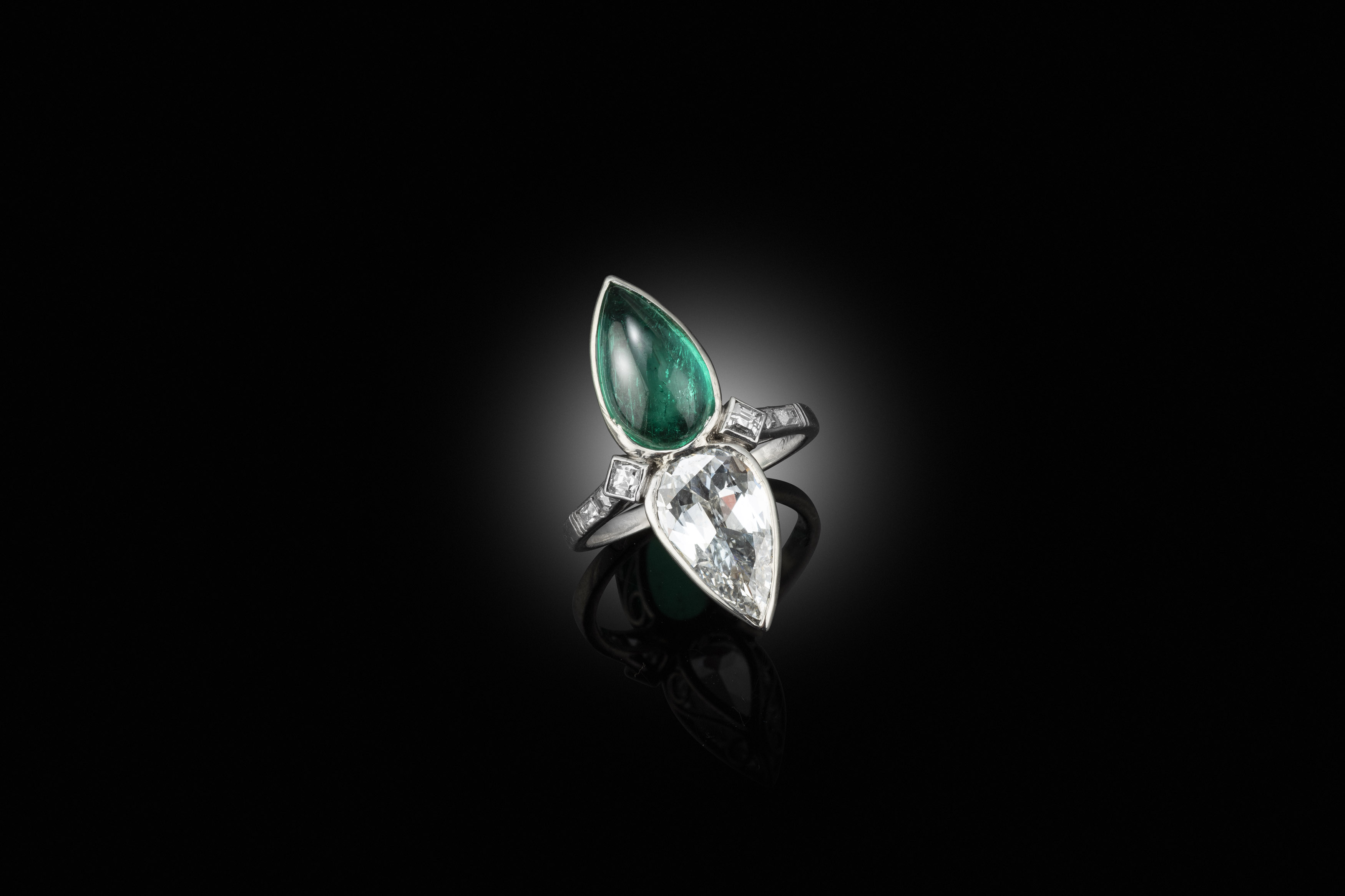 An early 20th century emerald diamond ring, circa 1915