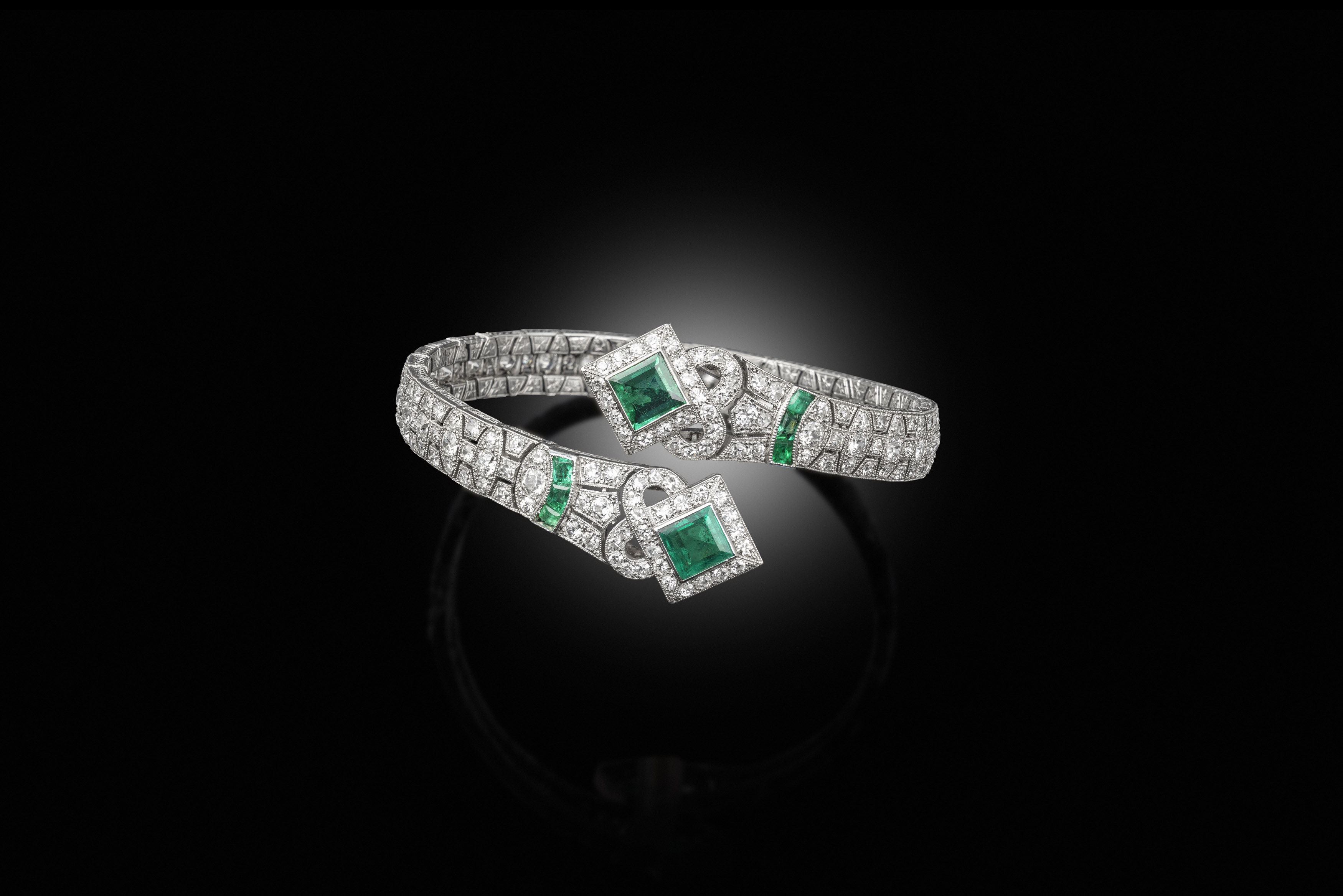 An art deco emerald and diamond armlet