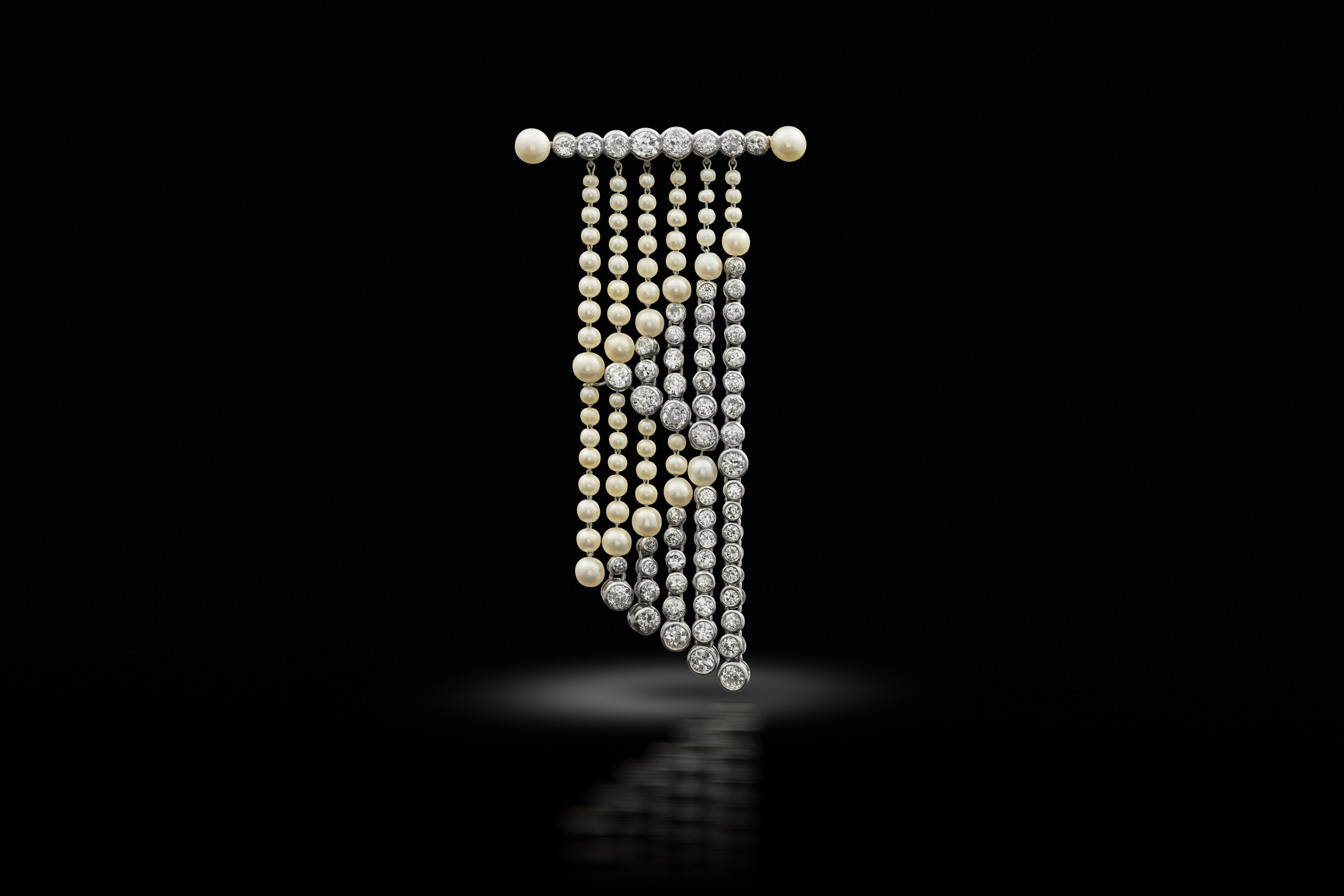 An early 20th century diamond and pearl fringe brooch